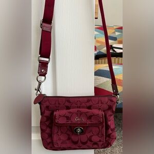Coach cranberry red canvas crossbody purse